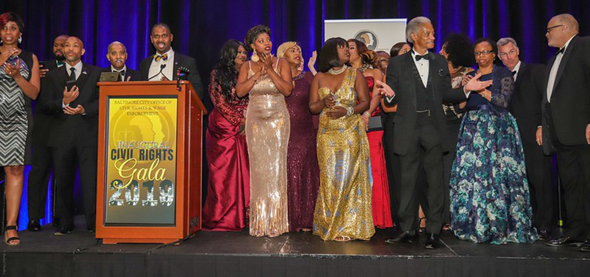 People on a stage at a podium